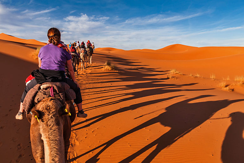 Camel ride through Sahara dunes, Morocco © Majonit - Flickr Creative Commons