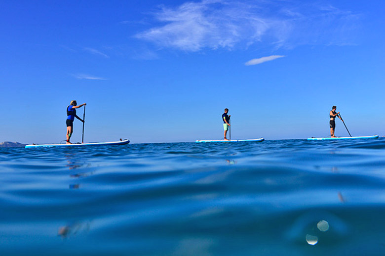 When the sea is calm stand up paddleboarding is a great way to explore