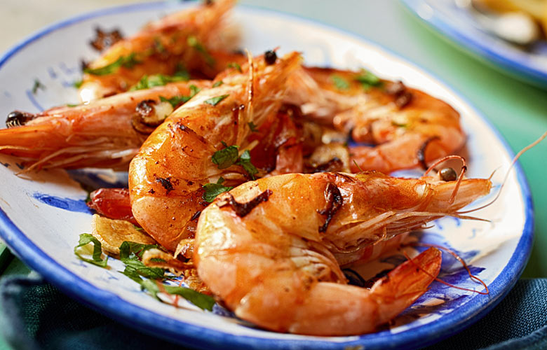 Grilled spicy prawns in a tapas bar in Malaga © Stockcreations - Dreamstime.com