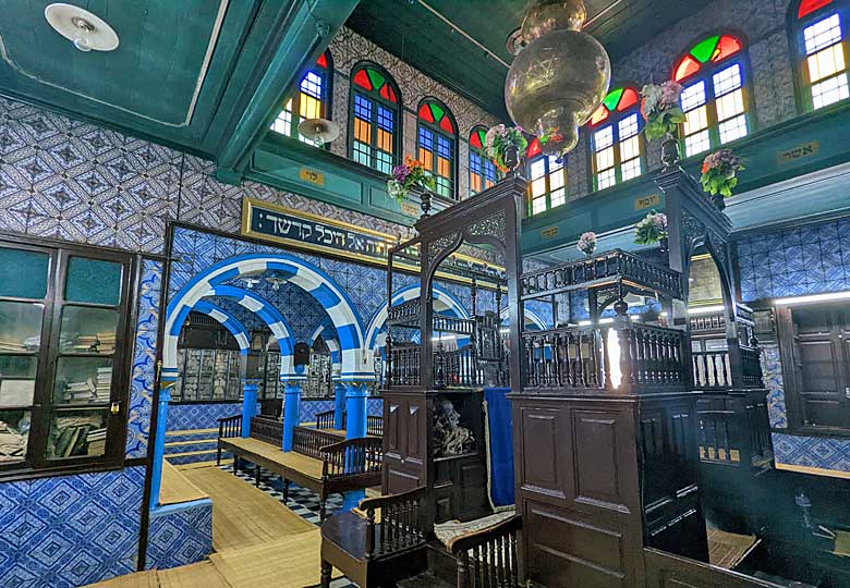 The colourful sanctuary inside the El Ghriba Synagogue © Kirsten Henton