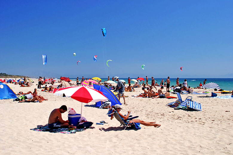 Colourful kites flying high above the beach in Tarifa © Nick Stubbs - Dreamstime.com