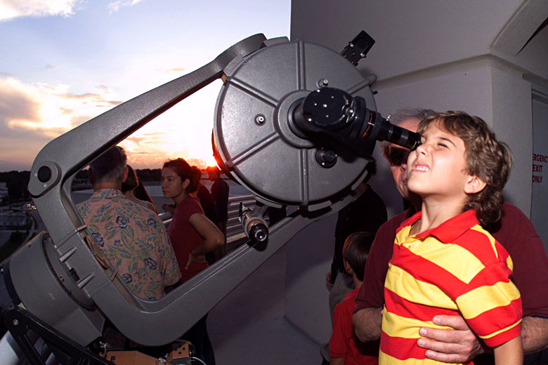 Looking through a telescope for the first time - photo courtesy of the Orlando Science Centre