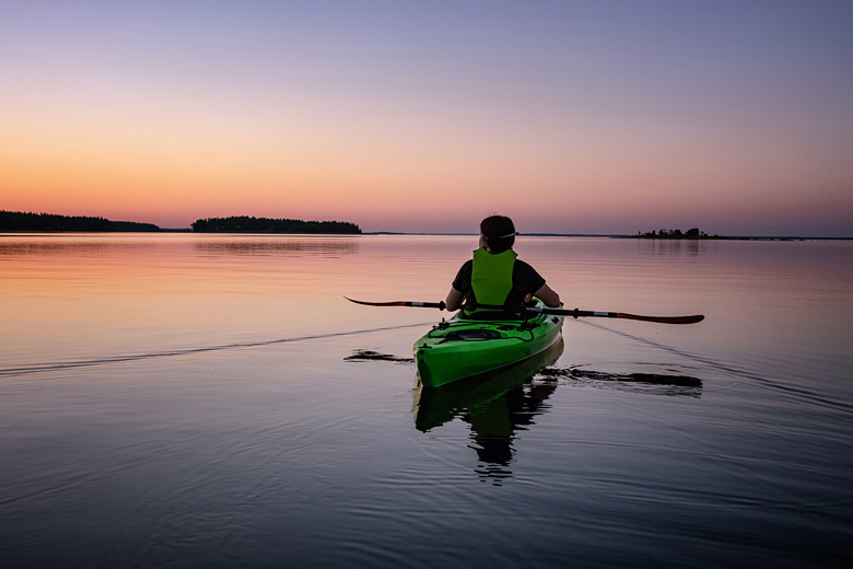 Kayaking in the midnight sun, northern Sweden