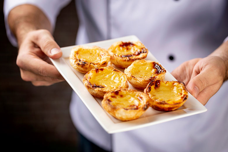 Delicious oven-fresh pastéis de nata © Beto Chagas - Adobe Stock Image