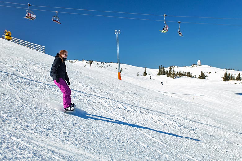 Snowboarder on the upper slopes of Jahorina