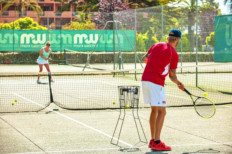 Take a tennis lesson from a pro at San Lucianu Resort