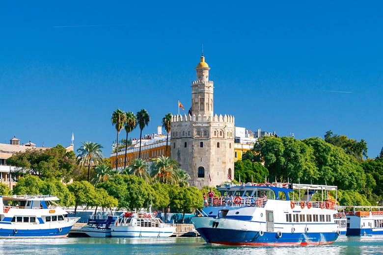 The Torre del Oro on the banks of the Guadalquivir River, Seville © Pillerss - Adobe Stock Image